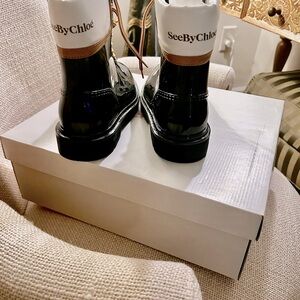 Beautiful SeeByChloe black patent leather rain boots.